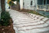 A heavy duty filter fabric is used in the driveway, to prevent soft spots.