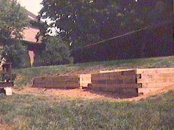 We built this railroad tie retaining wall with steps going up into the back yard in Bridgewater, NJ.